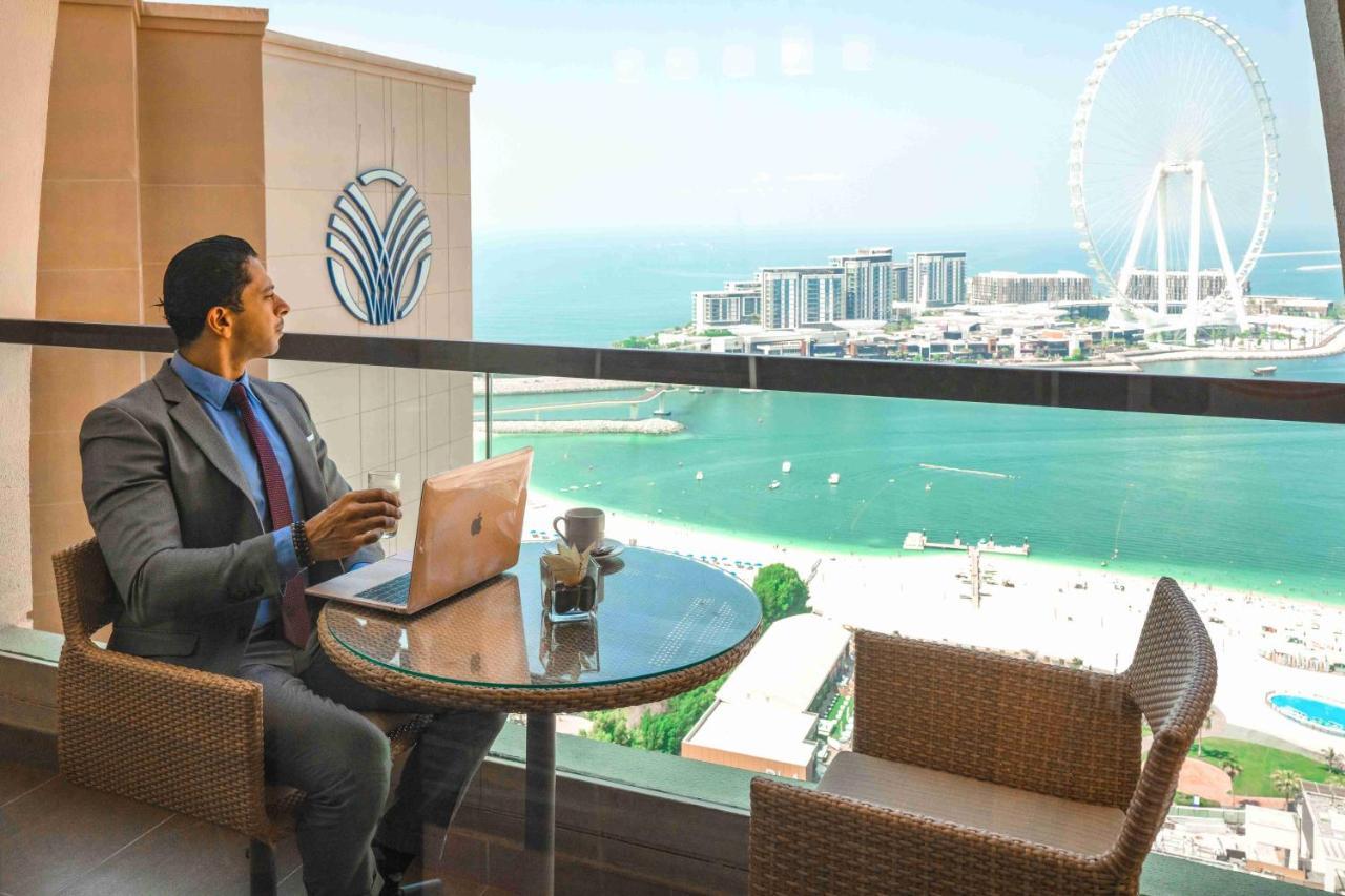 Amwaj Rotana, Jumeirah Beach - Dubai Esterno foto View of the Palm Jumeirah from the Westin Dubai